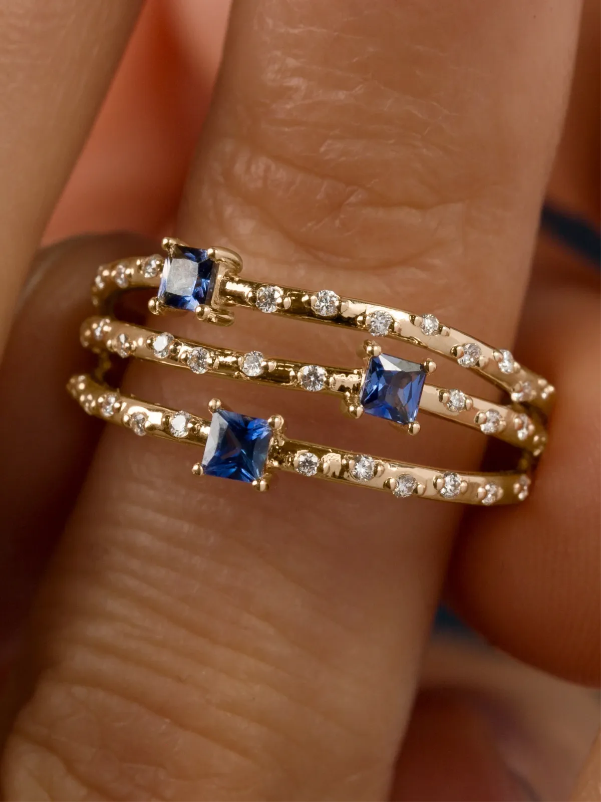 Macro product photography — ring on hand