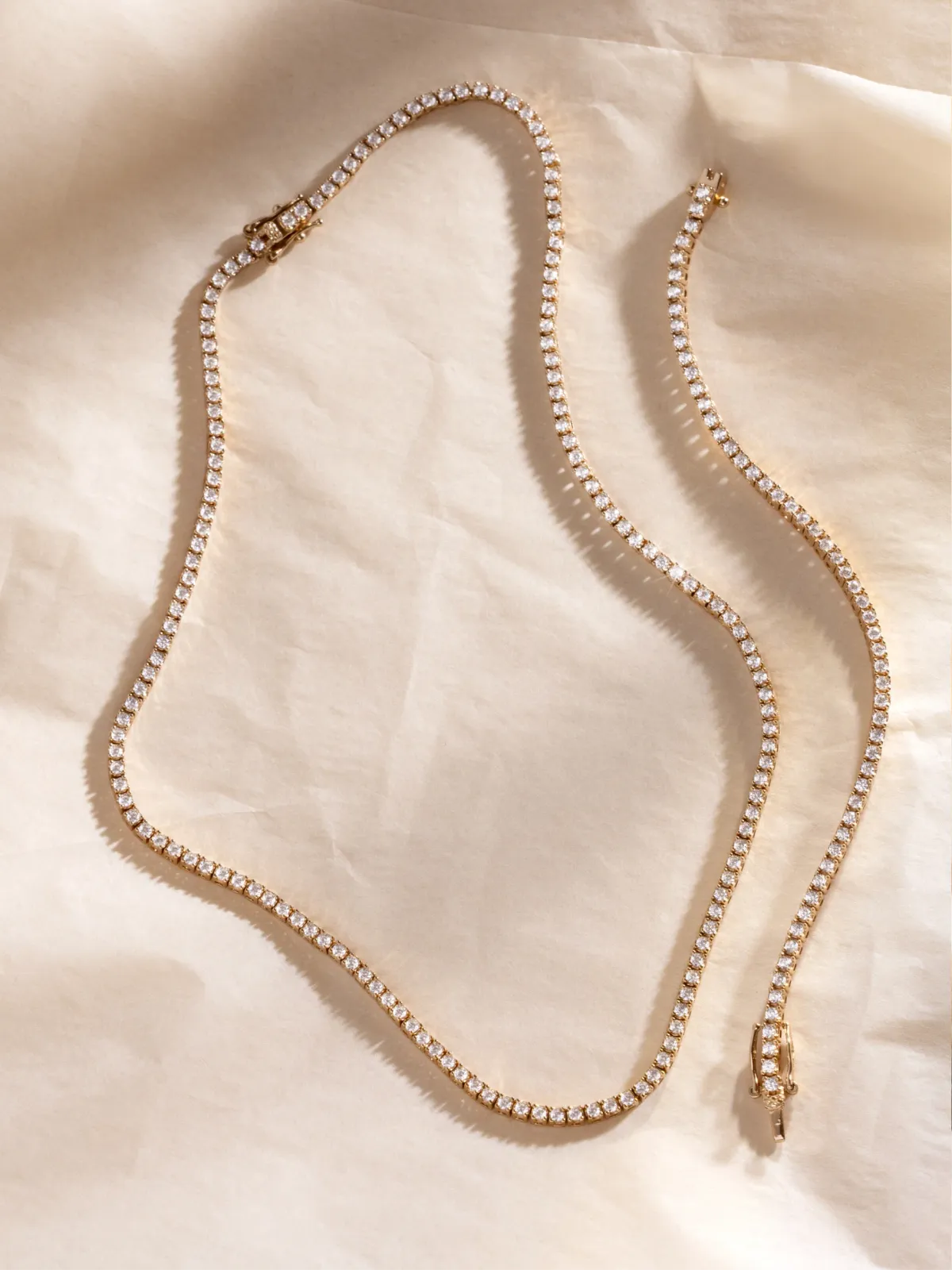 Flat lay — necklaces and bracelet