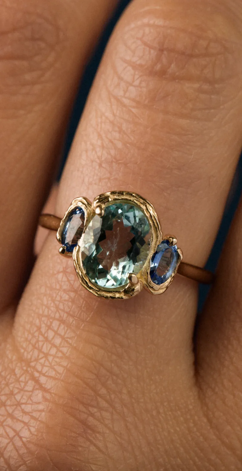 Macro product photography — ring on hand