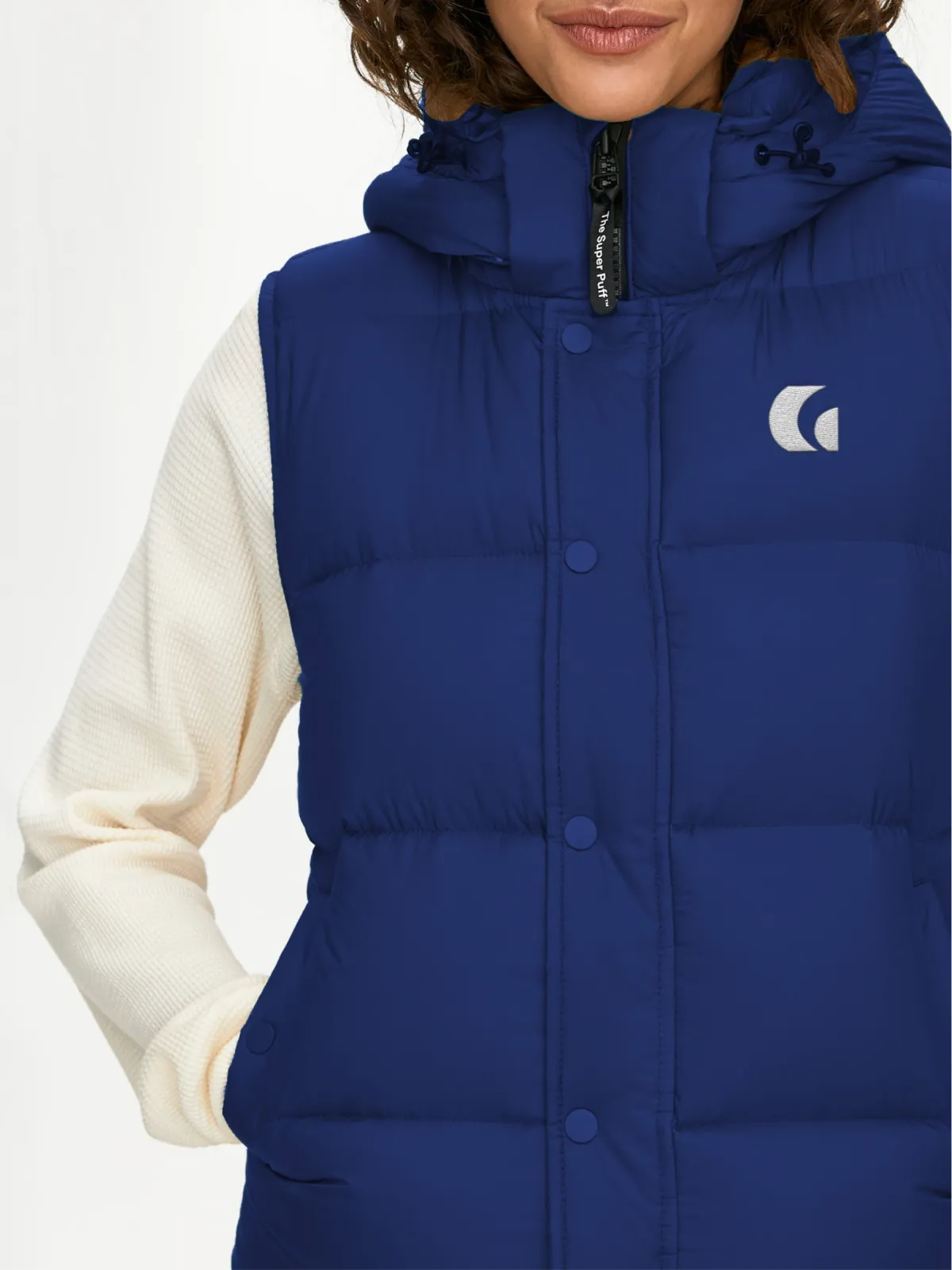 Branded merch — puffer vest detail