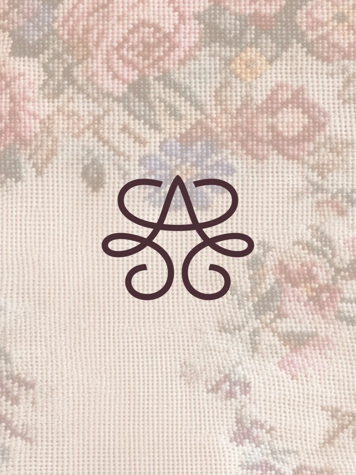 Brand monogram embroidery detail